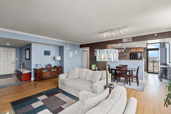 Living and dining areas looking toward kitchen and balcony - Academic Atmosphere: Study-Friendly Furnished Condo from Mom of Harvard, Yale, UChicago Grads