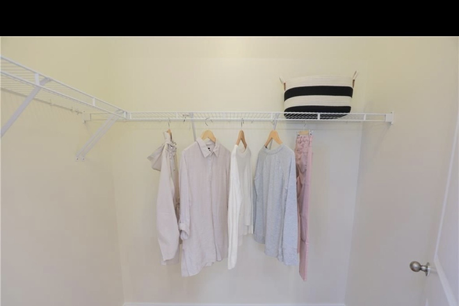 Walk in closet - Condo room with en suite bathroom for rent in the Fan District, close to campus, female roommate