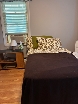 Twin bed and nightstand - Furnished bedroom with private bath.  We welcome short or long stays. House