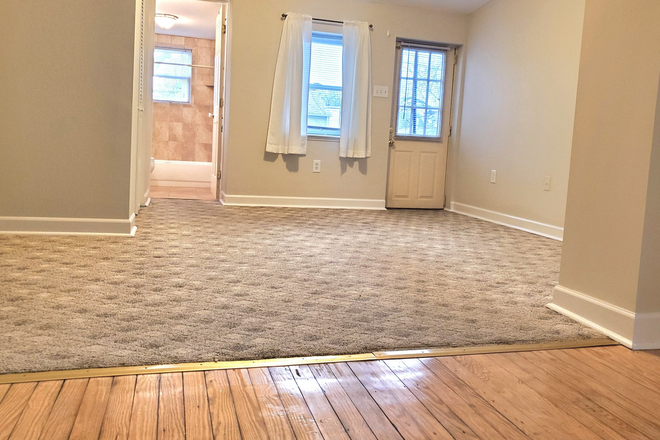 bedroom, facing bathroom and patio door on the right - Private Suite - All Utilities Included Apartments