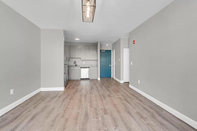 Another angle of living room - 109 W Lexington Apartments, modern, downtown, great transportation options