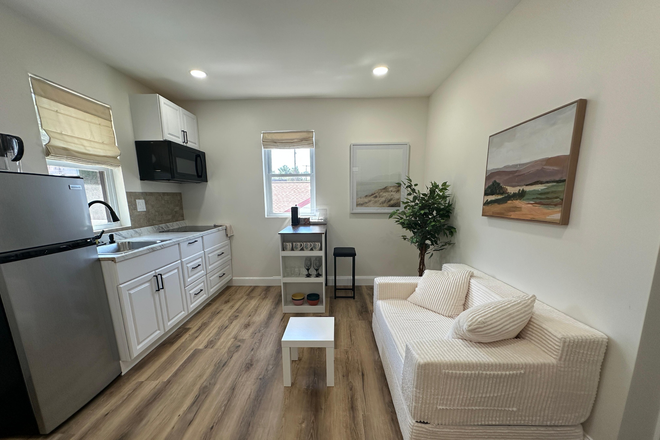 Living room/ Kitchen - Newly Renovated Furnished 2BR Suite Near UMD – Utilities Included