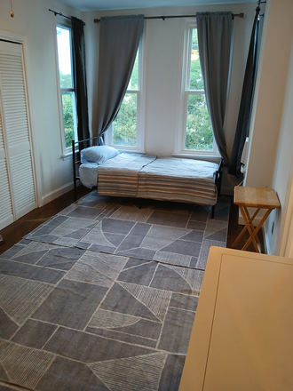 Bed with Sunny Window Views! - LARGE STUDIO Apt-$900- 10 Min to MCV Campus-15 Min to VCU Furnished & Utilities Included!