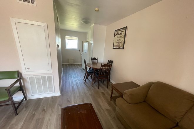 03- Living room open to dining and kitchen - 1 and 2 BR/1-Bath furnished apt 2.8 miles from Rice; Bills paid except electricity.