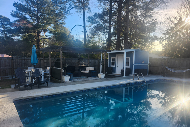 Nestled along side pool - pool open to tenant at own risk. - Poolside Cottage Apartments