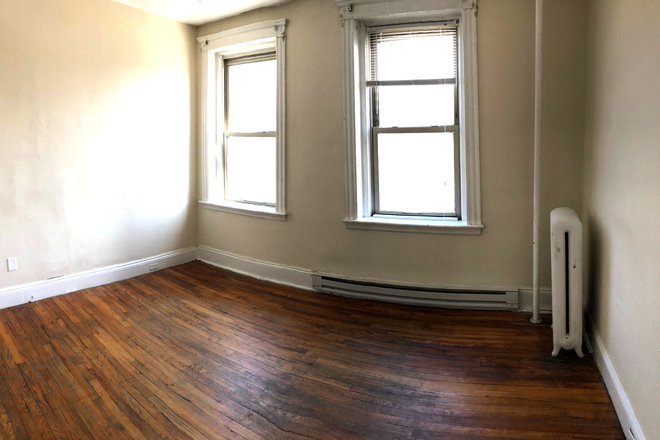 visit hubrealtyproperties.com - Front view studio with spacious area and handy location, in the Fenway Apartments