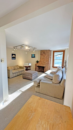 Living Room with Study Nook and Fireplace - 3 Bed, 1.5 Bath Two-Story Apartments Unit in Cambridge