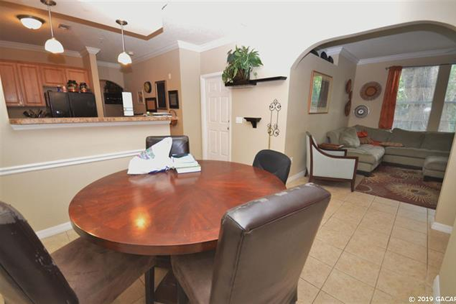Dining Room, Kitchen, Living Room - Campus View-Luxury Condo Walking Distance to UF, Shands, and  Sorority Row! 1/2 OFF 1ST MONTH RENT!!