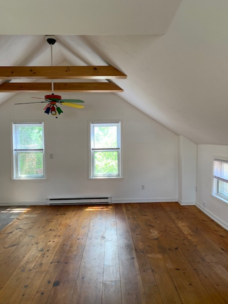 living area - 2nd floor studio with cathedral ceilings in Fox Point Apartments