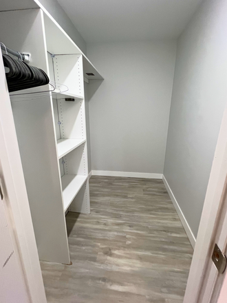 Primary Bedroom Closet - Arvada Court - Brand New and Furnished! Apartments