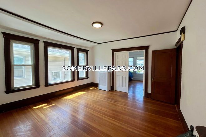 Living Room - Major Price Reduction! NO BROKER FEE! 4 Bed 1 Bath Apartment on W Adams St. in Somerville!