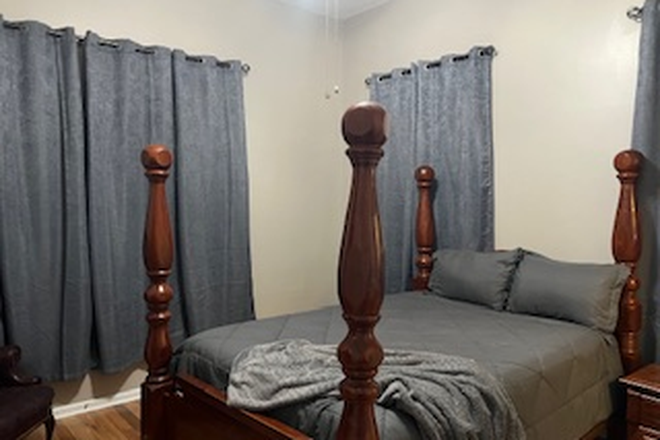 Bedroom 1 features Blackout curtains - Queen bed - Property close to MUSC, Roper, VA Hospital and College of Charleston Duplex