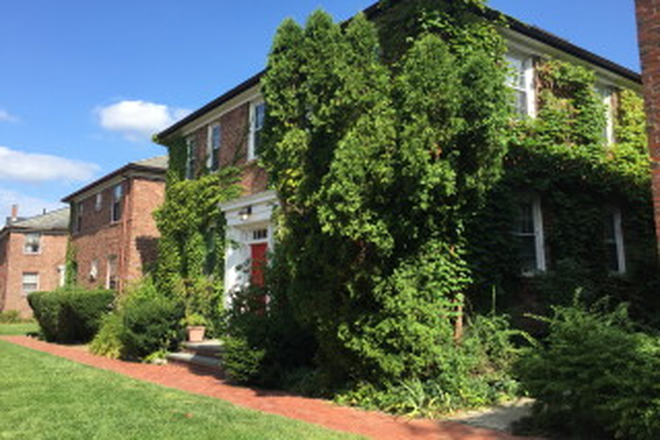 Well-maintained courtyard with common area seating - Ideal location near  Harvard QRAC (gym, tennis courts, indoor basketball court) Apartments