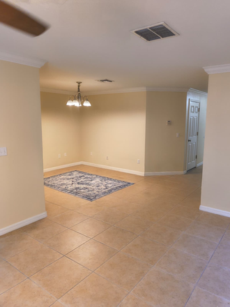 Living room. - Townhome Close to Campus - 20 Minute walk. Female Roommate Preferred.