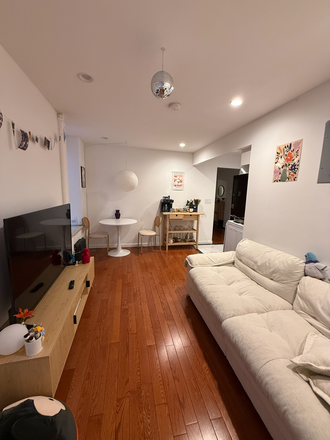 Living Room - Cozy Bedroom in East Village Close to NYU Apartments