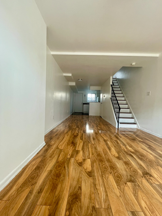 Living Room - Furnished Townhouse with Hardwood Floors, Washer-Dryer, Central AC, Balcony & Off-Street Parking