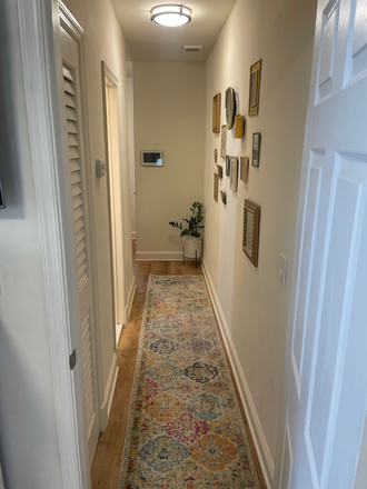 Hallway between bedrooms - ISO SUBLETTER in Tenleytown 2 Bed 1 Bath Apt- spacious with tons of natural light!