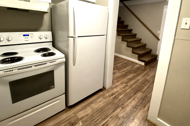 Kitchen looking east - 2-BR townhome in quiet area-laminate, hookups, central location-water, lawncare included