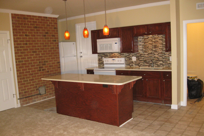 Studio Kitchen Area w/Oversized Island - Northern Durham just 8 miles from campus and near Eno River State Park. Apartments
