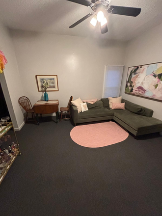 Living Room - Subletting Room for Spring with Private Bathroom and Parking Spot Townhome