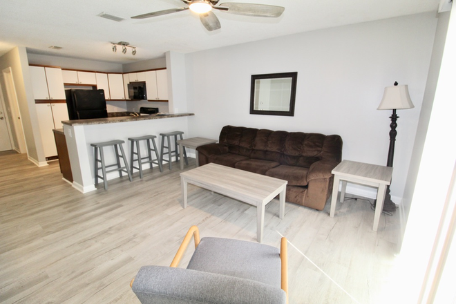 Living area - Hunters Ridge - 4 bed - 2 bath condo - now preleasing for the 2025-2026 school year!