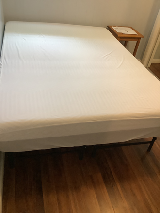 Full-sized bed and night stand - Bedroom Available in 3 BR 1 1/2 BA Aug 1, 2026-July 28, 2027 House