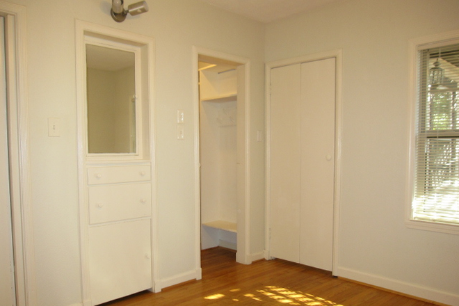 Bedroom has large walk-in closet. - Treetop apartment walking distance to Rice U.