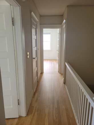 Hallway - Bright 2BR Top-Floor Apartment