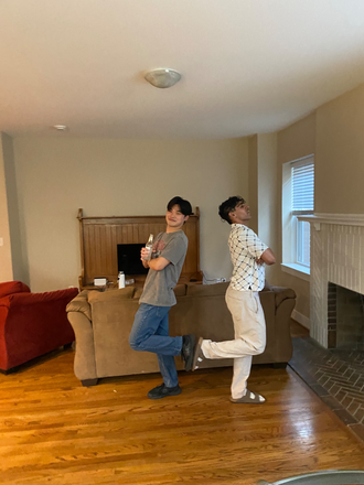 living room where furnished couch and fireplace are located. - Quadrangle Housing Apartments
