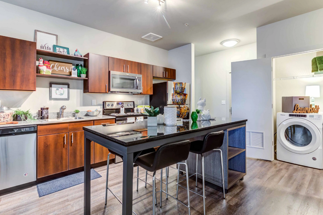 Kitchen + view of Laundry Room - Summer Lease Takeover (May-July) - SkyVue Apartment