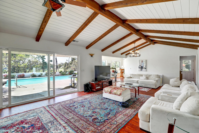 Living Room with Pool view - Amazing Villa-Styled Home in Canyon Crest