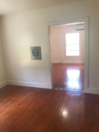 Bedroom looking into living space/kitchen - Studio Apartment All utilities included