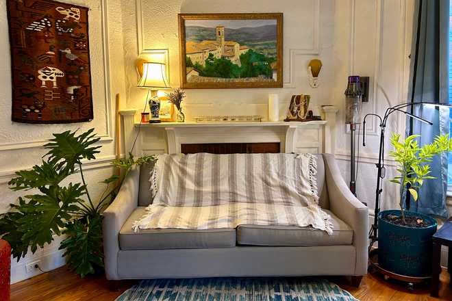 Living Room- 2 couches, one a fold-out for visitors and lots of shelving for books/games! - Cozy room in JP, close to Orange Line, just 20 min to campus
