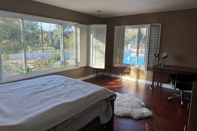 Master Bedroom with the Beautiful Pool and Backyard View - Amazing Villa-Styled Home in Canyon Crest