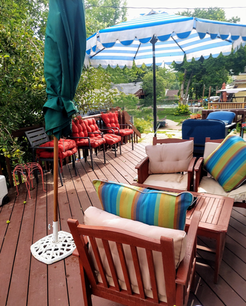 Plenty of comfortable seating on XL back deck - Furnished Dundee Studio, Includes utilities, wifi, parking, washer/dryer use, new furniture king bed House