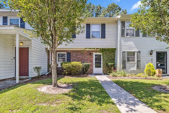 Front Door. Taken from the assigned parking spaces - 3 Bedrooms 2.5 Bath Two-story just a stone's throw away from Campus Townhome