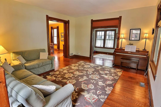 Living Room and adjoining Sunroom - Large Historic Home, close to busline, excellent condition