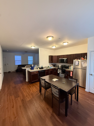 Kitchen, Living Room, and Half Bathroom - The Heights at State College 3 Bed 3.5 Bath
