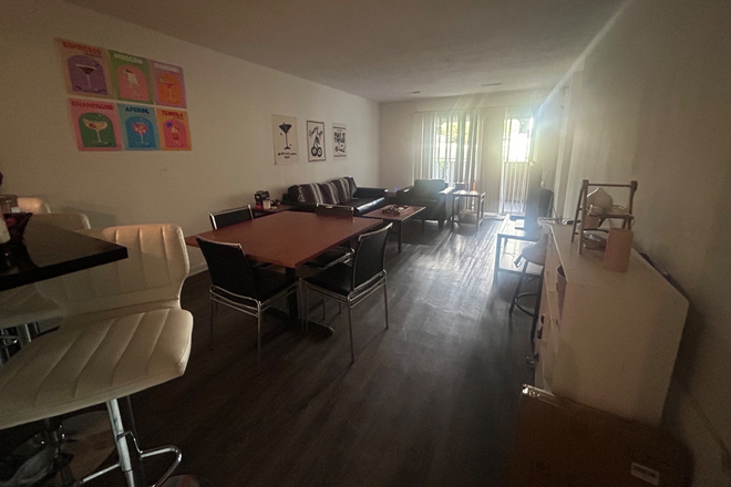 Living/Dining Room - The Harrison 4 bedroom (2 bedrooms available, separate leases) Apartments