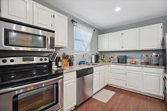 Kitchen - Stunning 4-Bedroom Home with Modern Comforts