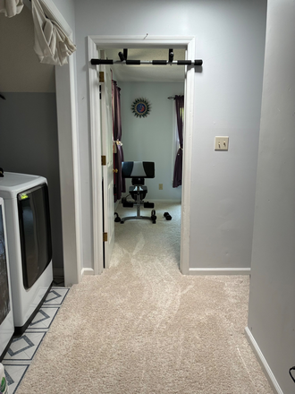 Hallway into workout space and washer/dryer - Private Upstairs Living Space in Carrboro House