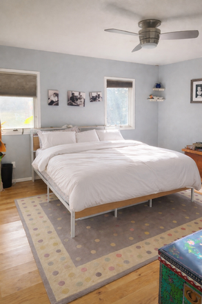 Downstairs master bedroom with a bathroom and walk in closet - Rare Boulder Home on Large Private Lot | 4BR/3BA | Available July