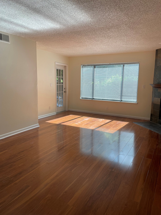 Living room & patio door - Renaissance Park II Condo