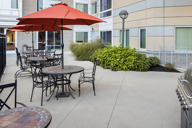 Courtyard with grills - Peninsula Apartment; Smart, Spacious & Close to UMass Boston