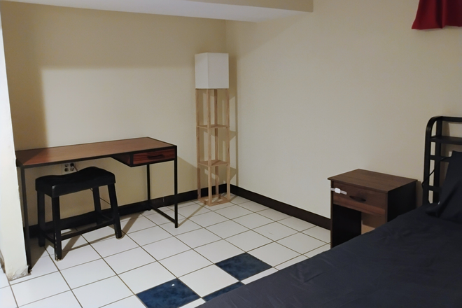 back corner of bedroom, with desk - Basement Apartment in Hollywood Neighborhood