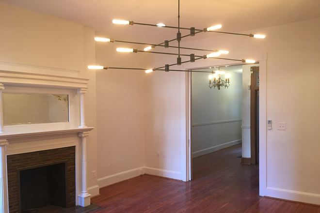 Dining room, with fireplace and pocket doors - Biddle Mansion Townhome