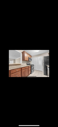 KITCHEN - ST. AUGUSTINE PLACE CONDOMINIUM.  Close to campus, dining, shops and highway.
