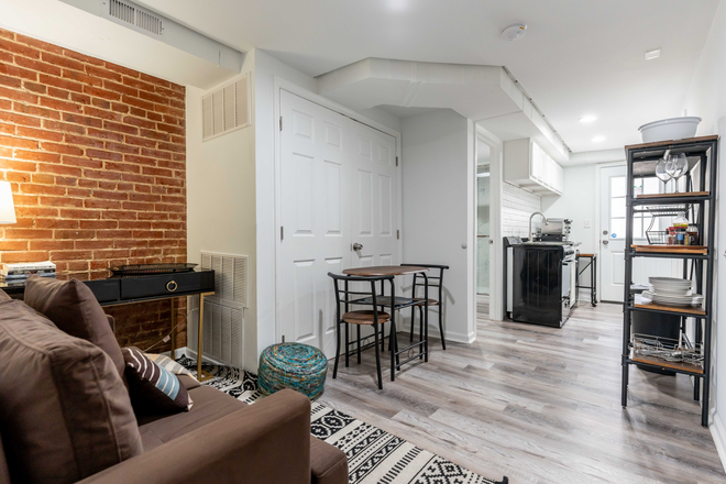 Living Room into Kitchen - Furnished 1BR/1BA Apartment