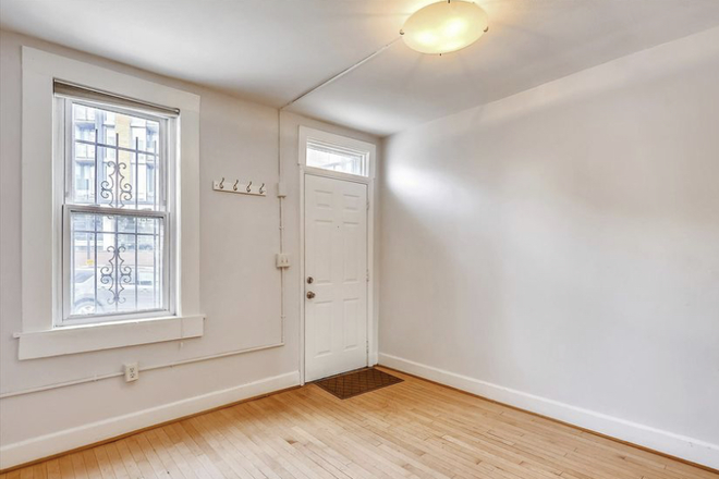 Front door, living room - 2 bed 1 bath single family townhome for rent, less than a mile from Howard U and Howard Hospital