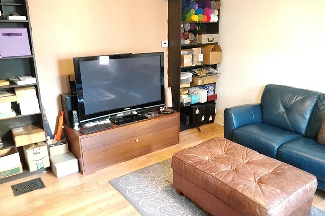 Living Room - First-Floor 2BR Near Davis Sq, Red Line, Laundry & Deck Apartments